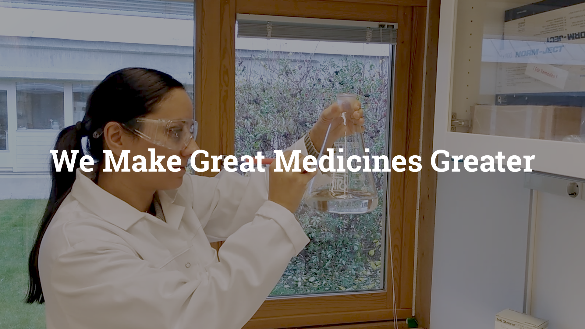 This is the lab of Double Bond Pharmaceutical in Uppsala. The slogan of the company - we make great medicines greater - is shown in the image.